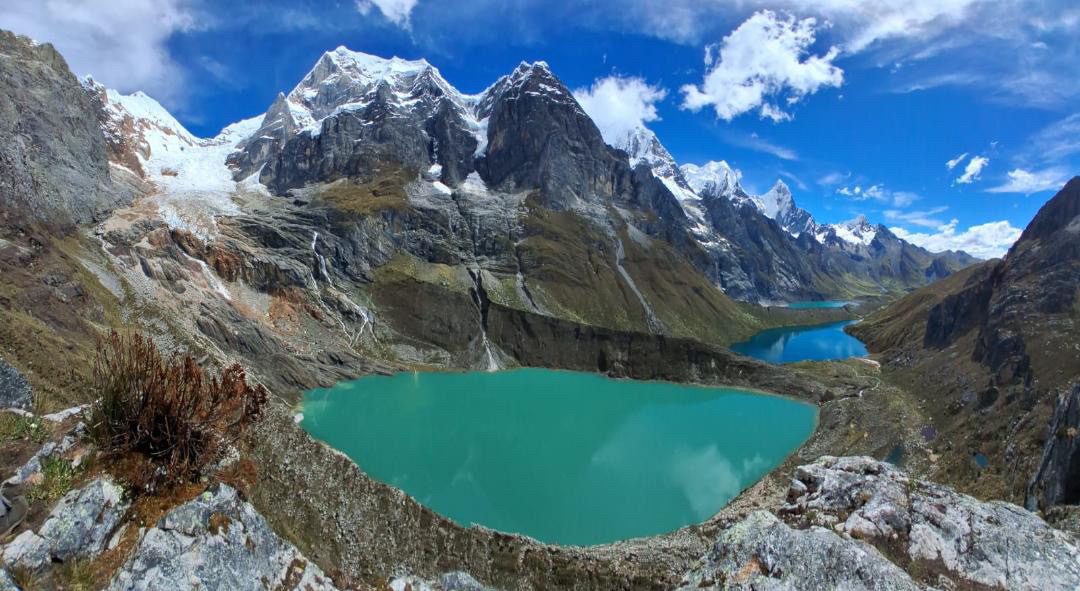 Turquoise lagoons stepped down a valley beneath the glaciated peaks of the Huayhuash.
